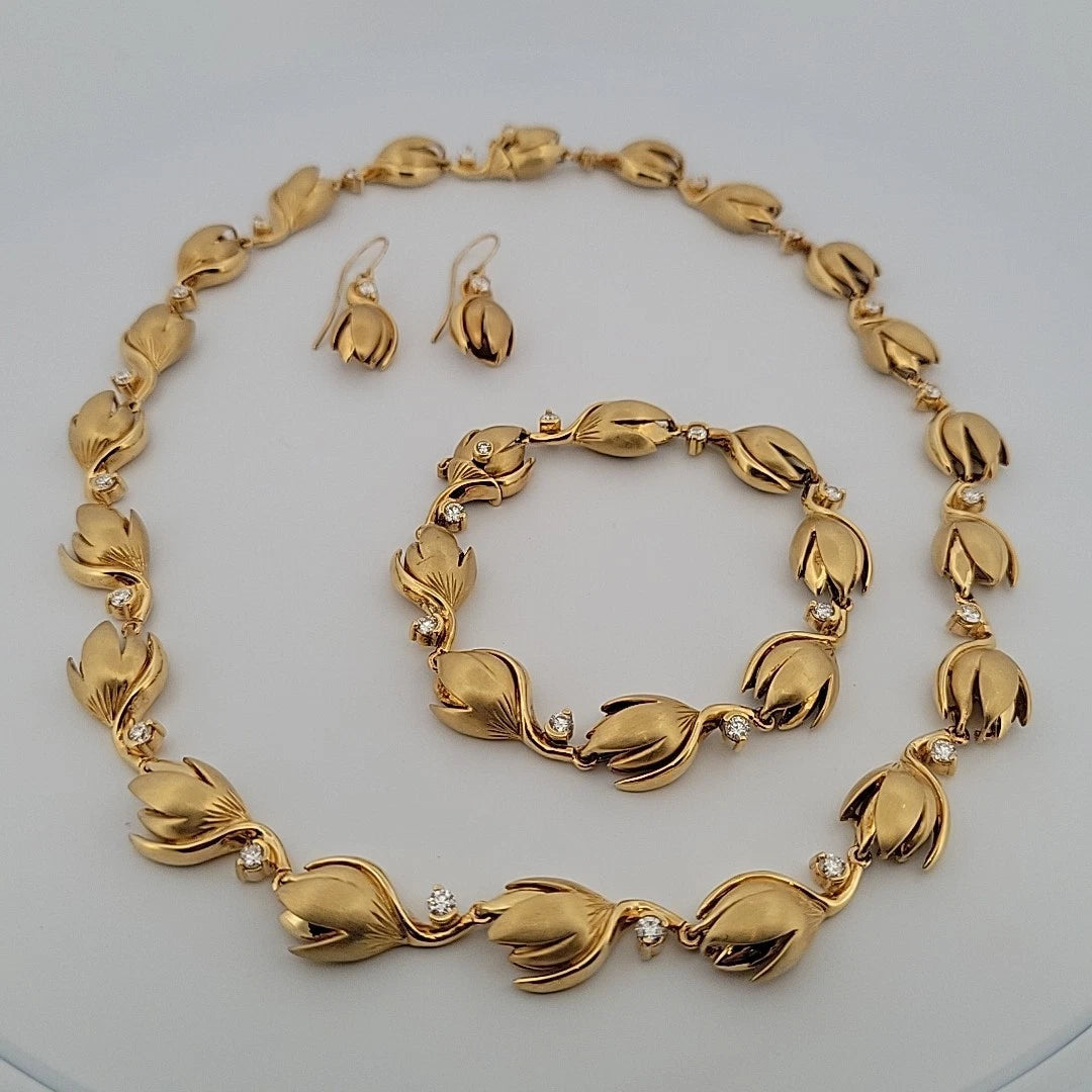 Na Hoku 18K Yellow Gold Pikake Diamond Necklace, Bracelet & Earrings Set 117.8gr by Devine & Co — angled view