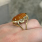 14K Yellow Gold Freeform Large Natural Orange Jadeite Cabochon & Diamond Ring by Devine & Co — close-up