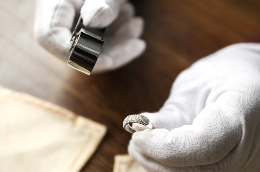 Jewelry inspection during a certified appraisal appointment at Devine and Co