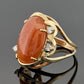 14K Yellow Gold Freeform Large Natural Orange Jadeite Cabochon & Diamond Ring by Devine & Co — angled view