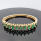 14K Yellow Gold Emerald & Diamond Bangle Bracelet, Marquise Emeralds, 7.5 Oval by Devine & Co — front view