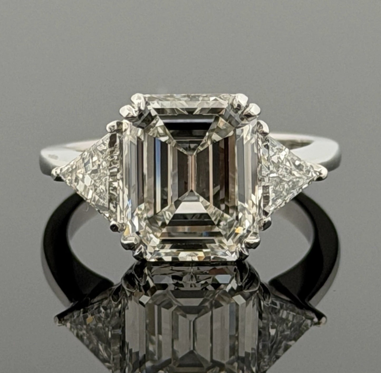 Platinum Three-Stone Ring 4.10ct Emerald Cut Natural Diamond GIA with Trillions by Devine & Co — detail view