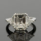Platinum Three-Stone Ring 4.10ct Emerald Cut Natural Diamond GIA with Trillions by Devine & Co — front view
