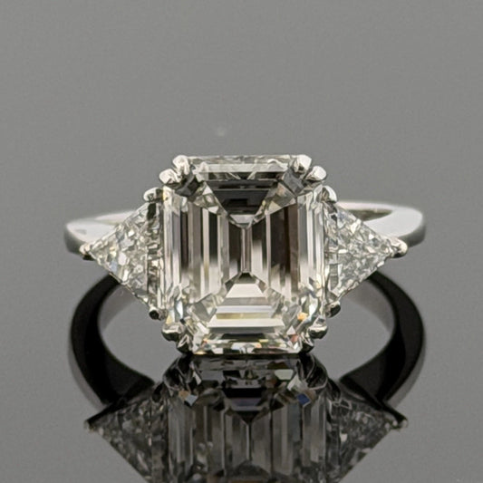 Platinum Three-Stone Ring 4.10ct Emerald Cut Natural Diamond GIA with Trillions by Devine & Co — front view