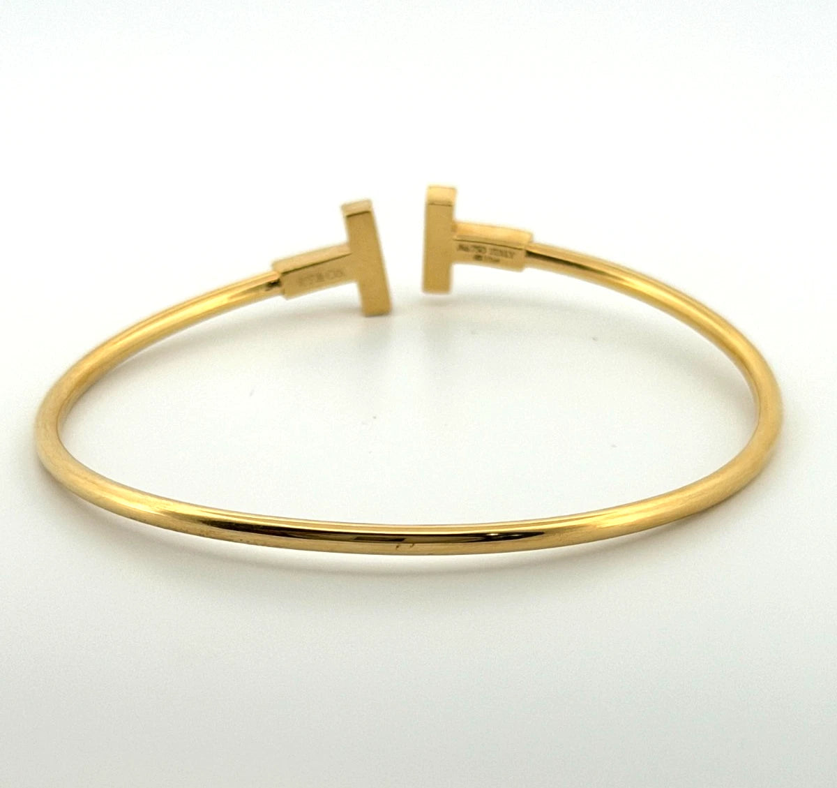 Tiffany & Co. T Wire Bracelet 18K Yellow Gold Mother of Pearl Diamond Bracelet by Devine & Co — angled view
