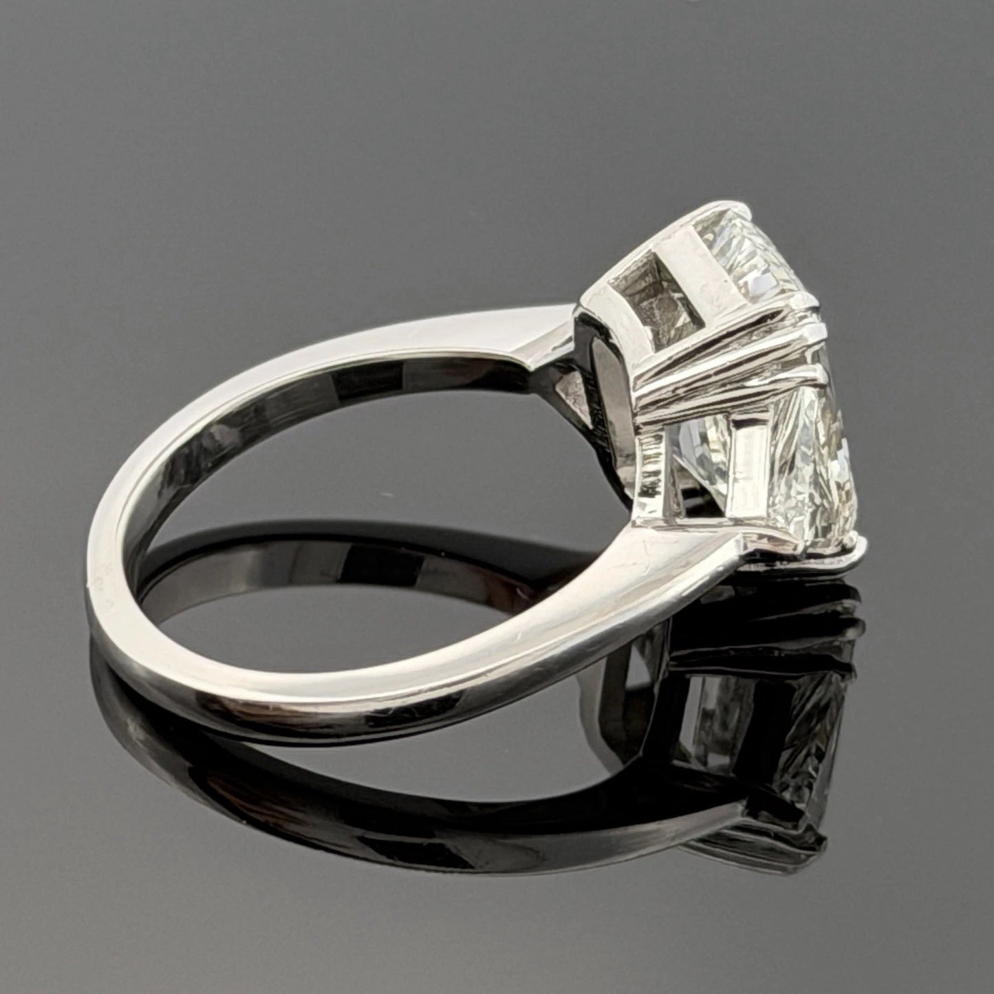 Platinum Three-Stone Ring 4.10ct Emerald Cut Natural Diamond GIA with Trillions by Devine & Co — side view