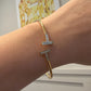 Tiffany & Co. T Wire Bracelet 18K Yellow Gold Mother of Pearl Diamond Bracelet by Devine & Co — detail view