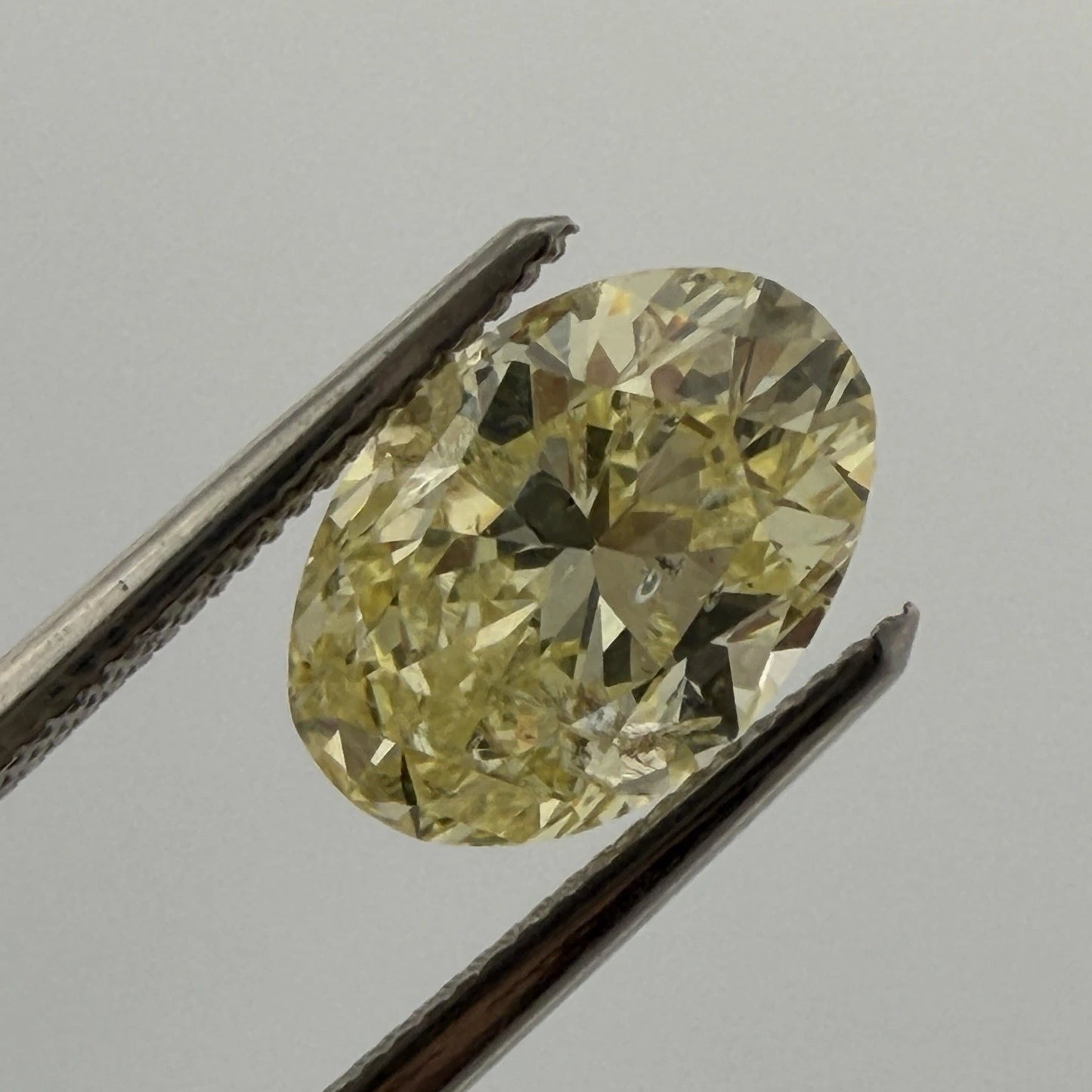 Natural Fancy Yellow Diamond GIA 2.12ct Oval Brilliant I2 Loose Diamond, color detail
