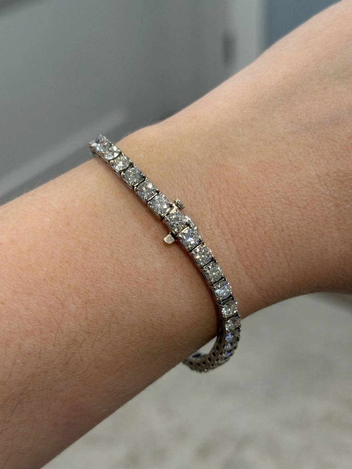 14K White Gold Natural Round Diamond Tennis Bracelet 9.80 ctw 7" G-H VS-SI by Devine & Co — front view