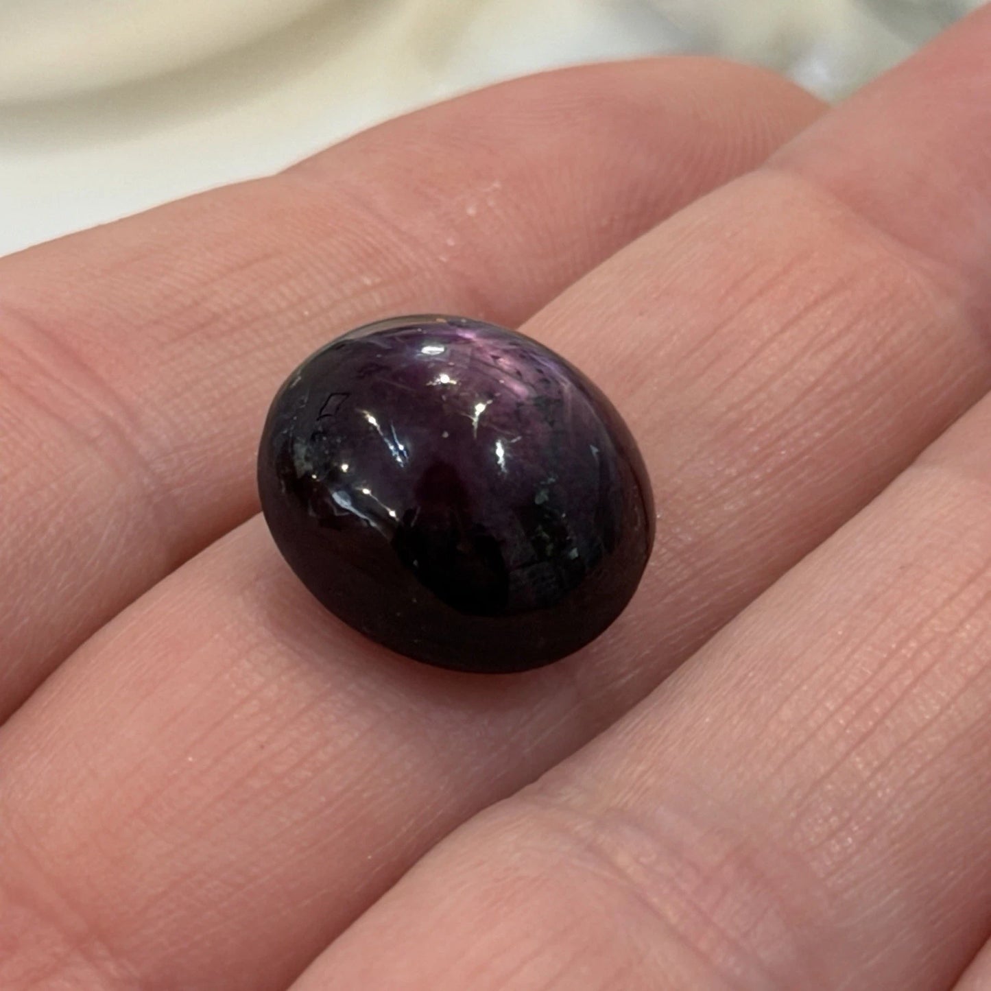 23.48 Carat Natural Oval Cabochon Star Ruby GIA Certified No Heat With Ring Mold, angled view